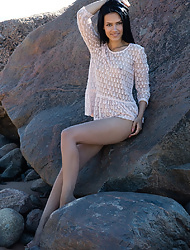 Dark haired brunette Lada A posing nude on rocks