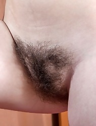 Fioryna naked on bed with her hairy pussy
